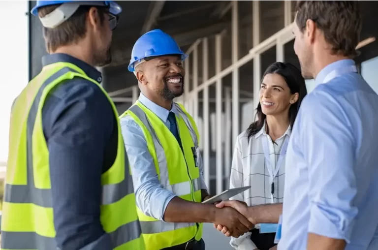 Happy engineers finalizing project | AST Canada
